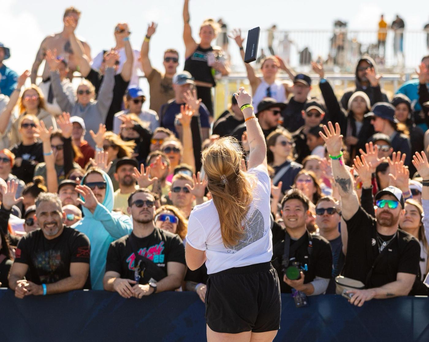 Fans cheering along the barricade